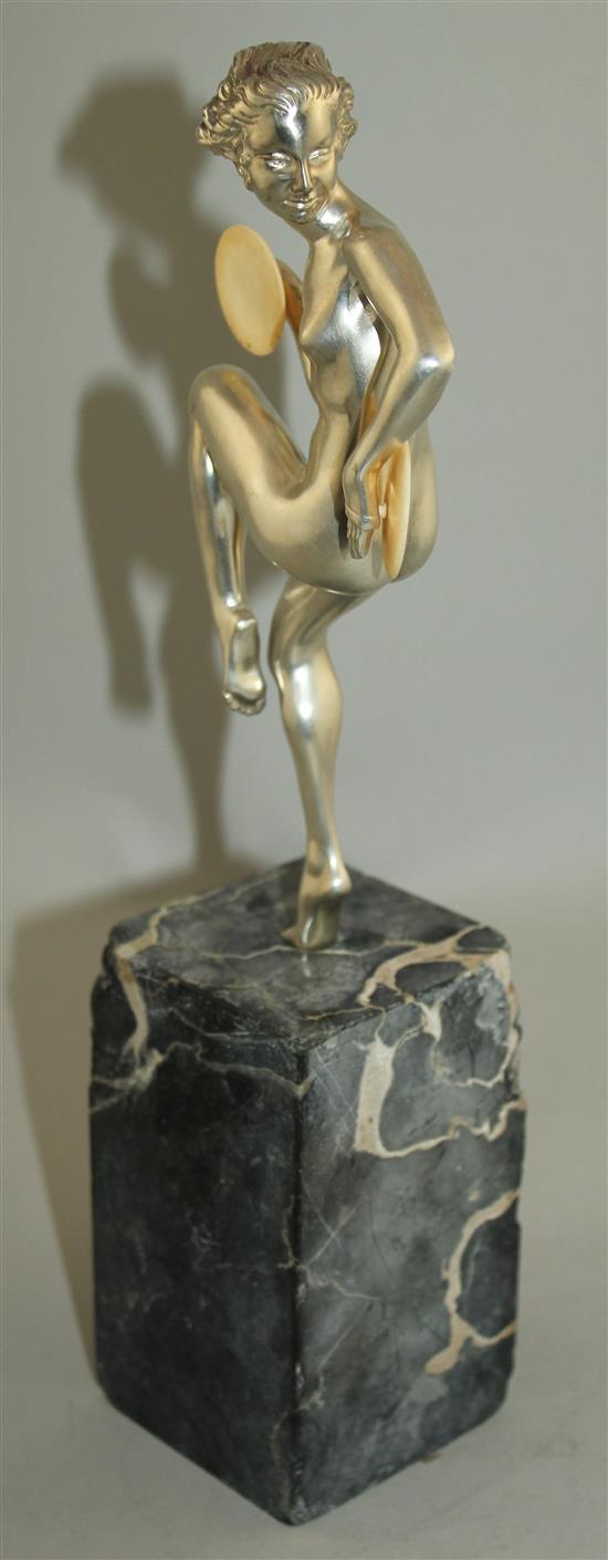 An Art Deco silvered bronze figure of a nude female dancer, overall 12.5in.